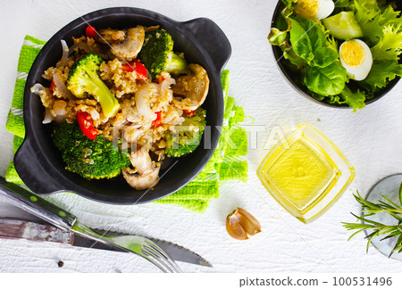 porridge with mushroom and boiled broccoli in bowl porridge with mushroom and boiled broccoli in bowl 100531496