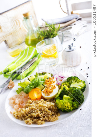 Salad with Prawns and Eggs with vegetables on plate 100531497