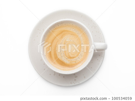 Black fresh hot creamy coffee in light porcelain cup on white background.Top view. 100534059