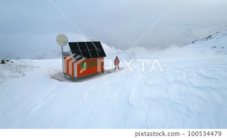 Rescue hut high in the mountains among the clouds Rescue hut high in the mountains among the clouds 100534479