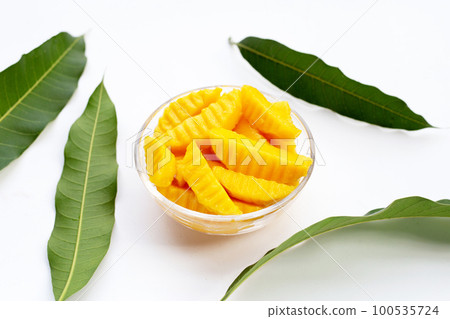 Sweet yellow mango fruit slices Sweet yellow mango fruit slices 100535724