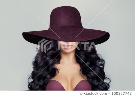Beautiful Model Woman with Curly Hairstyle in wide purple broad brim hat Beautiful Model Woman with Curly Hairstyle in wide purple broad brim hat 100537742