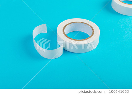 White Electrical Tape, Plastic Duct Tape Rolls, Colored Adhesive Tapes on Blue Background 100541663