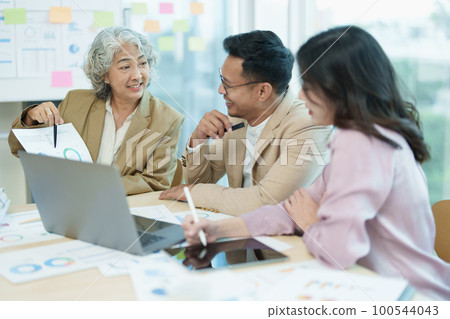 Asian entrepreneurs and business people meeting in a conference room in business planning, financial budget and investment risk assessment to analyze customer groups to increase company growth. Asian entrepreneurs and business people meeting in a conference room in business planning, financial budget and investment risk assessment to analyze customer groups to increase company growth. 100544043