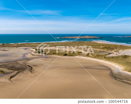 Aerial view of Ballyness Bay and Magheraroarty with the Muckish in the background in County Donegal - Ireland Aerial view of Ballyness Bay and Magheraroarty with the Muckish in the background in County Donegal - Ireland 100544716