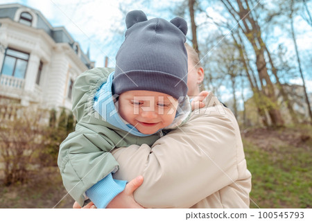 Happy mom holds baby in her arms Happy mom holds baby in her arms 100545793