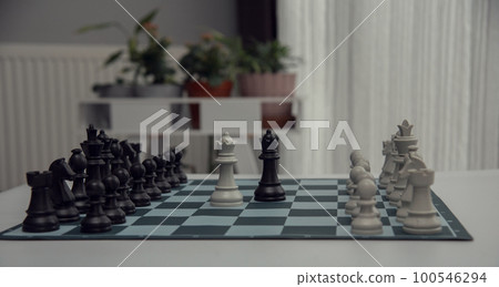 chess pieces on the white surface..Game of Chess. Close Up Playing Chess Game , Success Strategy. chess pieces on the white surface..Game of Chess. Close Up Playing Chess Game , Success Strategy. 100546294