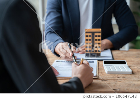 Home Insurance and Real estate investment concept, new client after signing agreement contract with approved property application form. Home Insurance and Real estate investment concept, new client after signing agreement contract with approved property application form. 100547148
