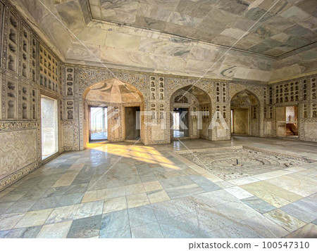 The famous red fort in the city of Agra, India. Tourists visit a popular tourist attraction. 100547310