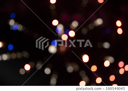 On a black background bokeh from explosions of colorful fireworks. 100549045