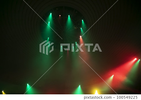 Green and red rays from stage spotlights on a dark background. Green and red rays from stage spotlights on a dark background. 100549225
