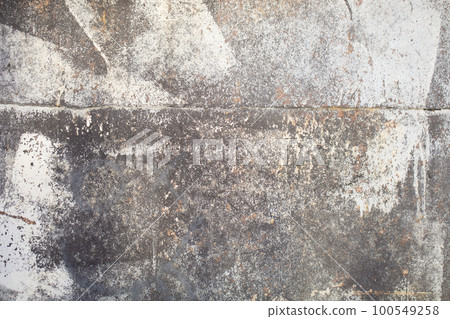 Texture of an old gray unevenly painted concrete wall. 100549258