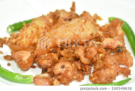 fried fermenting pork with garlic and fresh chili on plate fried fermenting pork with garlic and fresh chili on plate 100549638