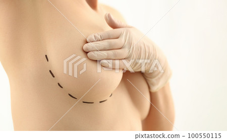 Beautiful woman covering breasts with black surgical lines Beautiful woman covering breasts with black surgical lines 100550115