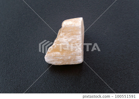 Red Gypsum stone mineral, black background, close-up, black background 100551591