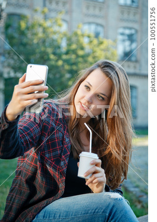 the student is sitting on the bench the student is sitting on the bench 100551756