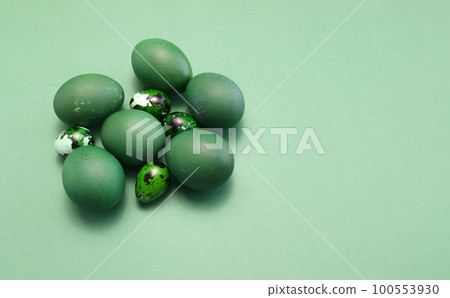 Blue green Easter chicken, quail eggs on blue background. Minimalism. Pascha or Resurrection Sunday,Christian festival and cultural holiday concept. Copy space for text on right side. Horizontal plane Blue green Easter chicken, quail eggs on blue background. Minimalism. Pascha or Resurrection Sunday,Christian festival and cultural holiday concept. Copy space for text on right side. Horizontal plane 100553930