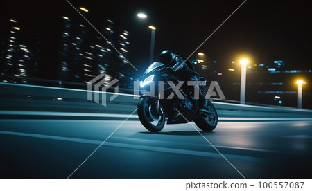 A man rides a sports motorcycle in the city at night A man rides a sports motorcycle in the city at night 100557087