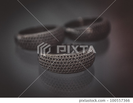 Object printed on metal 3d printer close-up. Object printed in laser sintering machine. Modern 3D printer printed from metal powder. Concept progressive additive DMLS, SLM, SLS Object printed on metal 3d printer close-up. Object printed in laser sintering machine. Modern 3D printer printed from metal powder. Concept progressive additive DMLS, SLM, SLS 100557366