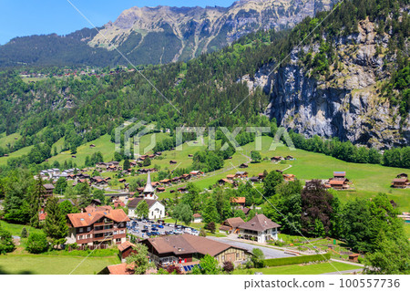 View of Lauterbrunnen village in Lauterbrunnen Valley in Bernese Oberland, Switzerland. Switzerland nature and travel. Alpine scenery View of Lauterbrunnen village in Lauterbrunnen Valley in Bernese Oberland, Switzerland. Switzerland nature and travel. Alpine scenery 100557736