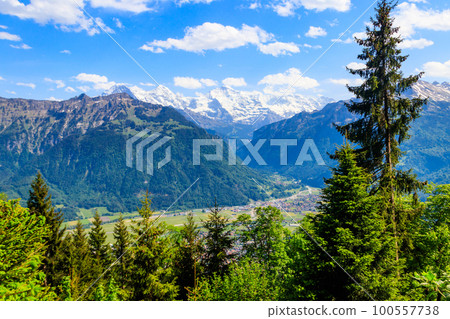 Breathtaking aerial view of Interlaken and Swiss Alps from Harder Kulm viewpoint, Switzerland Breathtaking aerial view of Interlaken and Swiss Alps from Harder Kulm viewpoint, Switzerland 100557738