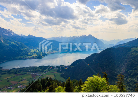 Breathtaking aerial view of Lake Thun and Swiss Alps from Harder Kulm viewpoint, Switzerland Breathtaking aerial view of Lake Thun and Swiss Alps from Harder Kulm viewpoint, Switzerland 100557740