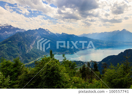 Breathtaking aerial view of Lake Thun and Swiss Alps from Harder Kulm viewpoint, Switzerland Breathtaking aerial view of Lake Thun and Swiss Alps from Harder Kulm viewpoint, Switzerland 100557741