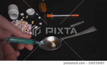 addict's table pills and injection on the black table addict's table pills and injection on the black table 100558987