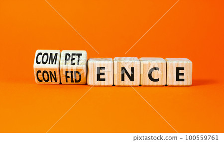 Competence and confidence symbol. Concept word Competence Confidence on wooden cubes. Beautiful orange table orange background. Business competence confidence concept. Copy space. 100559761