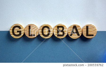 Wood circles with word 'global' on paper blue and white background, copy space. Business concept success process. 100559762