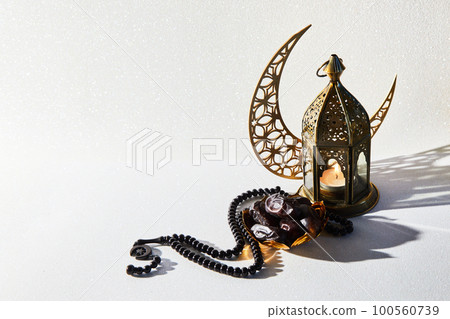Muslim Holy Month Ramadan Kareem - Ornamental Arabic Lantern With Burning Candle 100560739