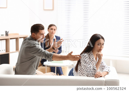Professional psychologist working with couple in office Professional psychologist working with couple in office 100562324