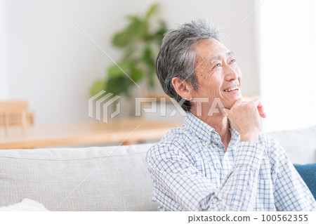 Senior man thinking with a smile 100562355