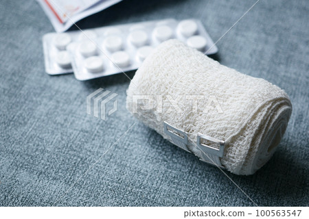 adhesive bandage and a bag on table  100563547