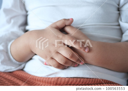 child suffering stomach pain close up. child suffering stomach pain close up. 100563553
