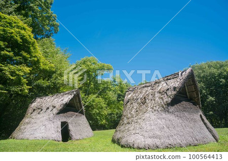 Recreated ancient Japanese pit dwellings 100564413