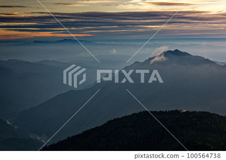 Mt. Shikujodake and Mt. Hakusan in the afterglow seen from the Northern Alps near Nishiho Sanso 100564738