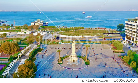 Aerial photograph of the historical Izmir clock tower with a sea view 100569140