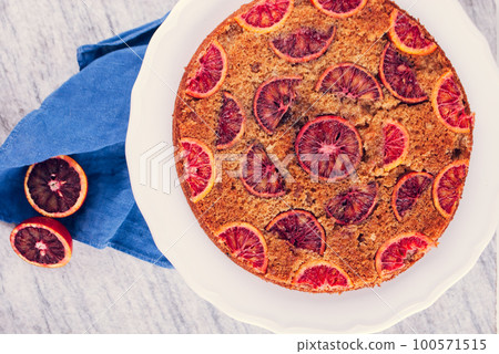 delicious cake with red oranges slices on top delicious cake with red oranges slices on top 100571515