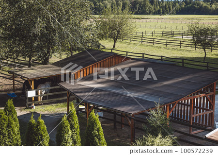 Rooftops for some shade on the horse ranch on a hot summer day Rooftops for some shade on the horse ranch on a hot summer day 100572239