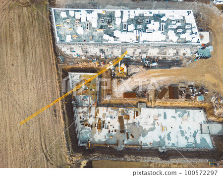 Top down view construction site of two residential buildings in progress  100572297