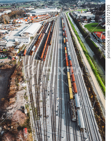Vertical photo, aerial view of cargo trains standing still at the train station Vertical photo, aerial view of cargo trains standing still at the train station 100572305