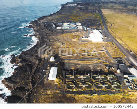 Aerial view of water treatment plant by the sea Aerial view of water treatment plant by the sea 100572442
