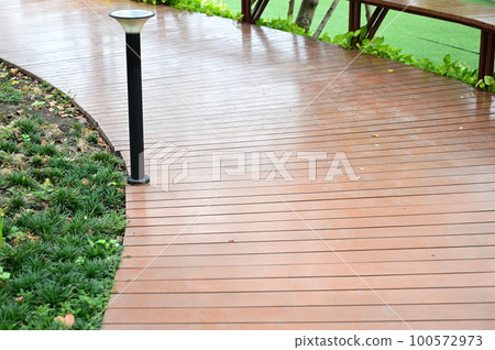 natural garden with wooden bridge, beautiful garden 100572973