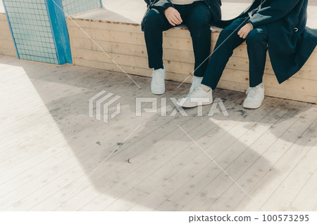 Photo of male college students talking in the park Photo of male college students talking in the park 100573295