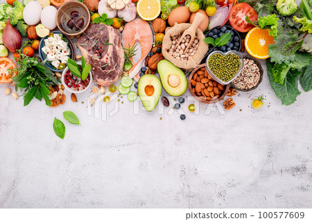 Ketogenic low carbs diet concept. Ingredients for healthy foods selection set up on white concrete background. Ketogenic low carbs diet concept. Ingredients for healthy foods selection set up on white concrete background. 100577609