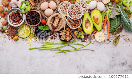 Ingredients for the healthy foods selection. The concept of superfoods set up on white shabby concrete background with copy space. Ingredients for the healthy foods selection. The concept of superfoods set up on white shabby concrete background with copy space. 100577611
