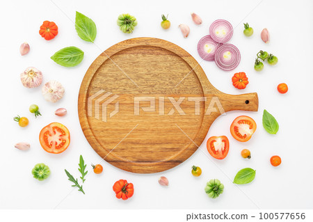 The ingredients for homemade pizza set up on white concrete background. 100577656