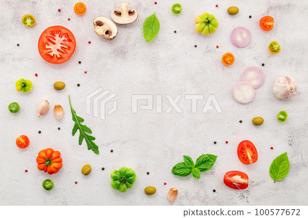 The ingredients for homemade pizza set up on white concrete background. The ingredients for homemade pizza set up on white concrete background. 100577672