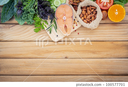 Ketogenic low carbs diet concept. Ingredients for the healthy foods selection set up on wooden background Ketogenic low carbs diet concept. Ingredients for the healthy foods selection set up on wooden background 100577701